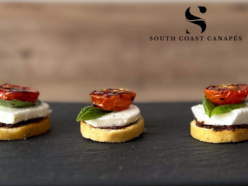 Mozzarella, olive, tomato and basil crostini
